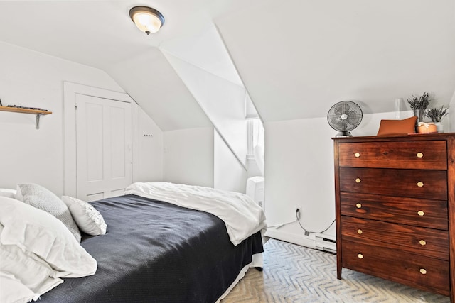 carpeted bedroom featuring vaulted ceiling