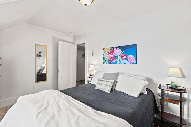 bedroom featuring lofted ceiling