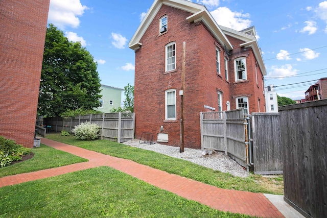 view of property exterior featuring a yard