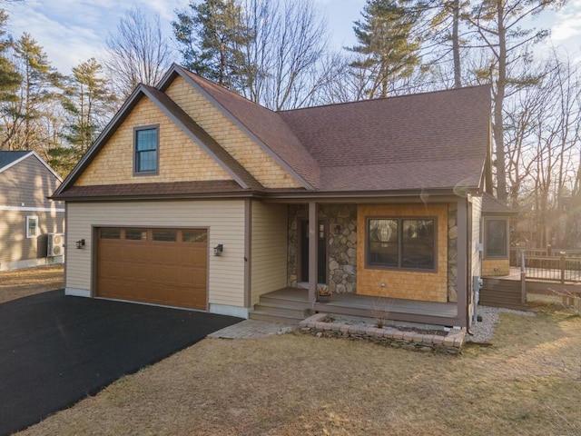 view of front of house featuring covered porch and a garage