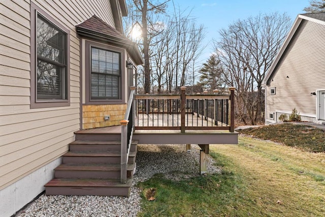 wooden terrace with a yard