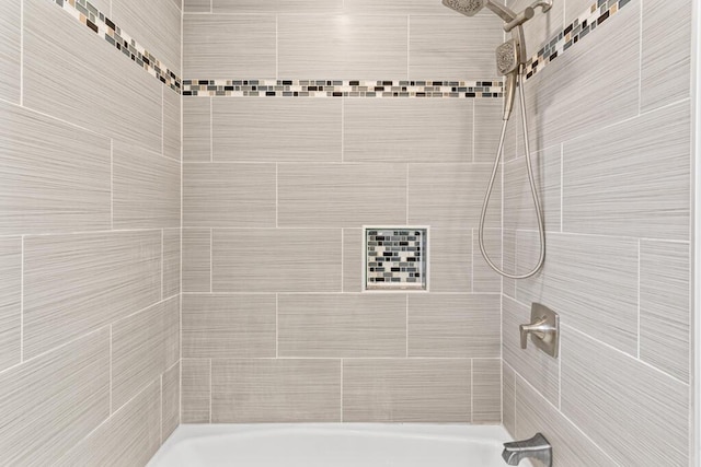 bathroom with a tile shower