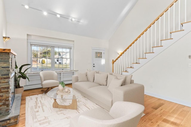 living room with light hardwood / wood-style floors and a baseboard radiator