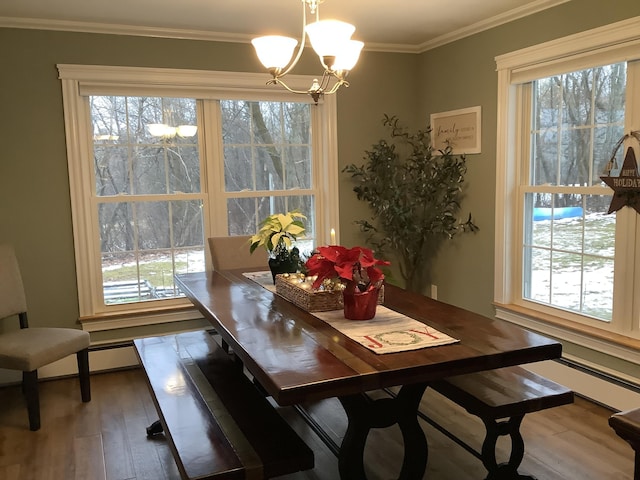 dining room with a wealth of natural light, a notable chandelier, and ornamental molding