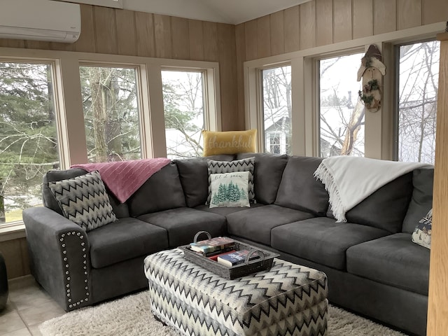 sunroom featuring an AC wall unit