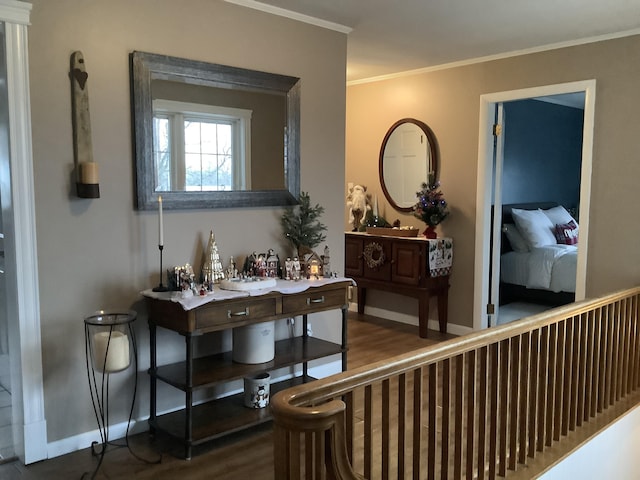 hallway with dark hardwood / wood-style floors and ornamental molding