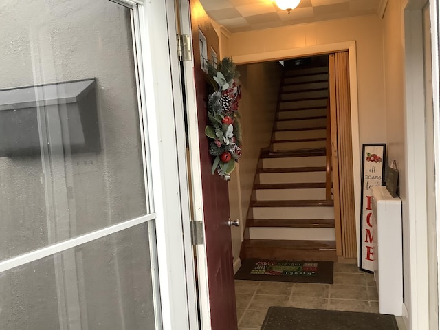 stairway with tile patterned flooring