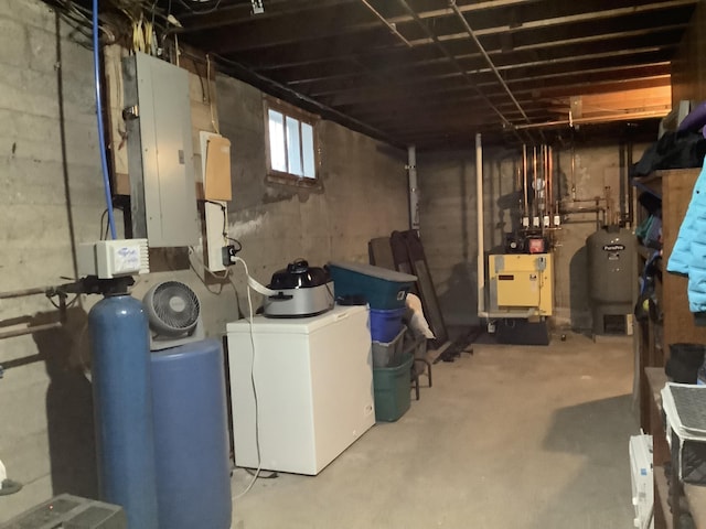 basement featuring washer / dryer and electric panel