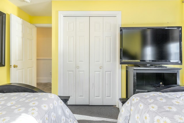 carpeted bedroom featuring a closet