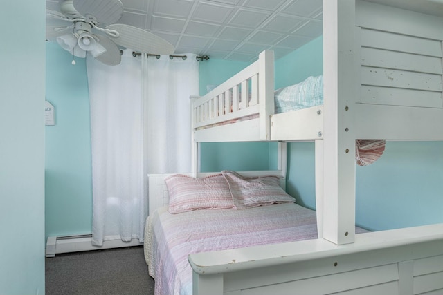 bedroom with carpet floors, a baseboard radiator, and ceiling fan