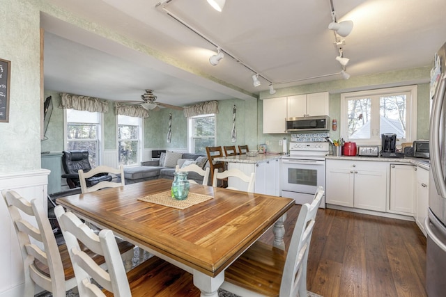 kitchen featuring electric range, ceiling fan, light stone counters, dark hardwood / wood-style floors, and white cabinets