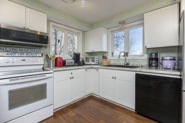 kitchen with dishwasher, dark wood-type flooring, white cabinets, sink, and white range with electric stovetop