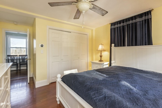 bedroom featuring a closet, ceiling fan, and dark hardwood / wood-style floors