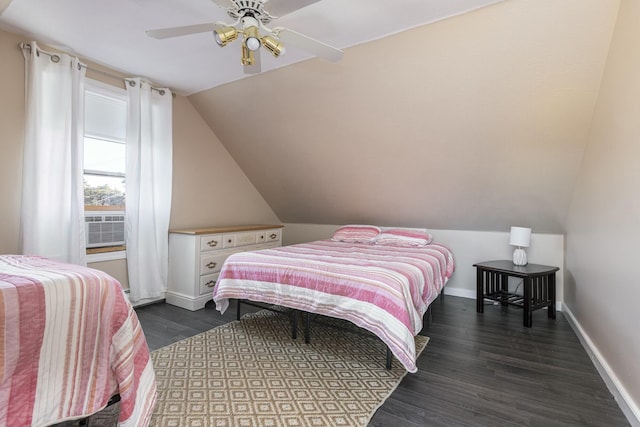 bedroom with ceiling fan, lofted ceiling, and dark wood-type flooring