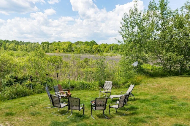 view of yard featuring an outdoor fire pit