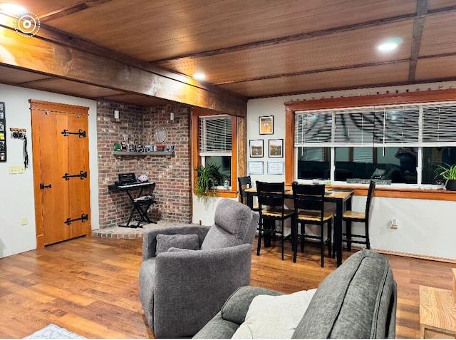 living area featuring light wood-type flooring and wood ceiling