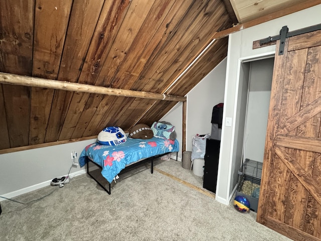 bedroom with a barn door, baseboards, lofted ceiling, wood ceiling, and carpet flooring