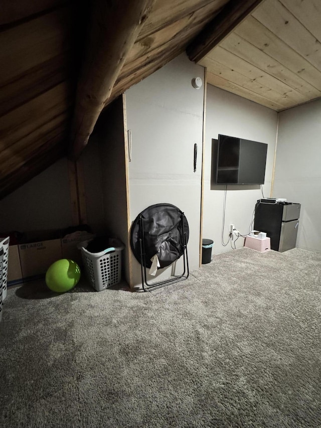 additional living space featuring carpet, wood ceiling, and vaulted ceiling