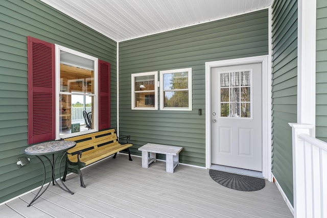 view of exterior entry with covered porch