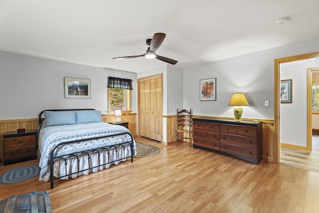 bedroom featuring a closet, light hardwood / wood-style flooring, and ceiling fan