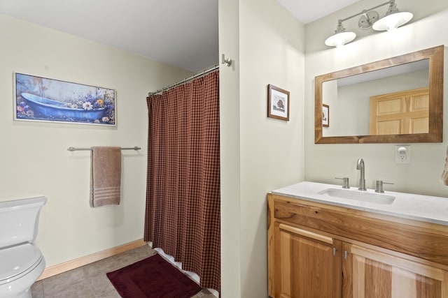 bathroom featuring tile patterned floors, vanity, toilet, and walk in shower