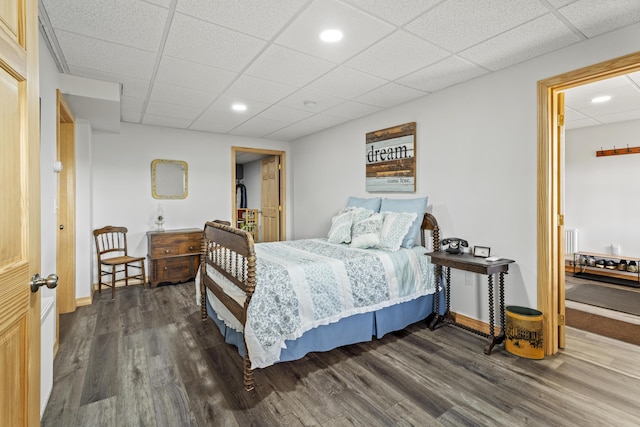 bedroom with dark wood-type flooring