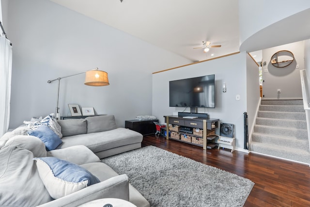 living room with ceiling fan, high vaulted ceiling, and dark wood-type flooring