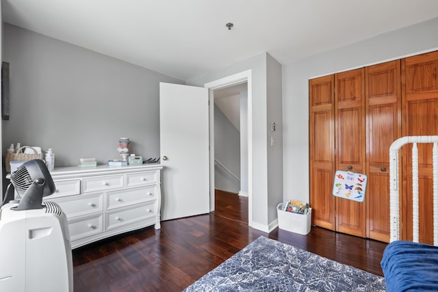 bedroom with dark hardwood / wood-style floors