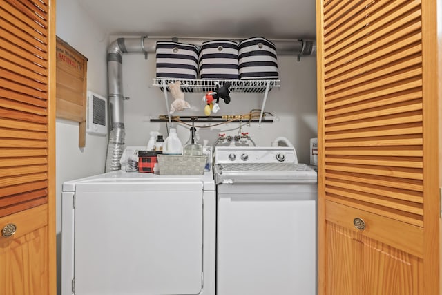 laundry area with washing machine and clothes dryer