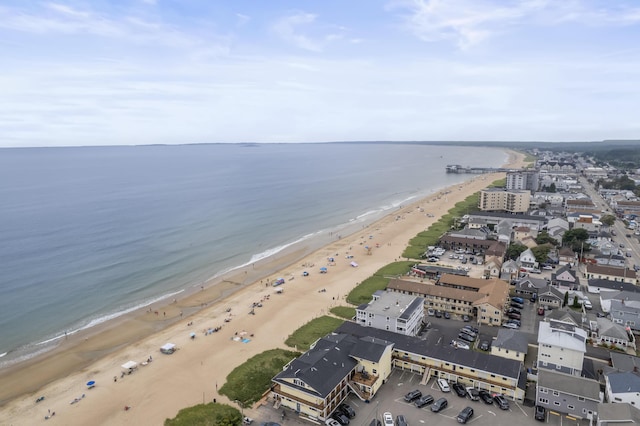 birds eye view of property with a water view and a view of the beach