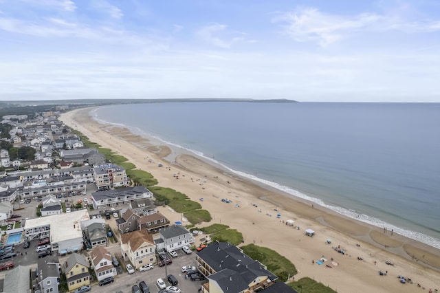 aerial view with a water view and a beach view