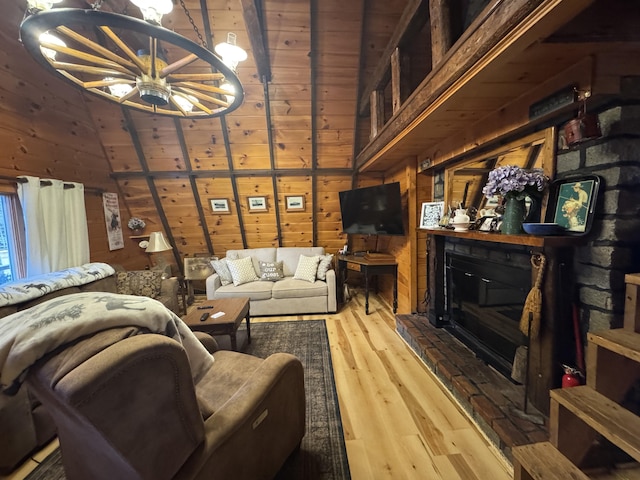 living room with hardwood / wood-style flooring, ceiling fan, wooden ceiling, and wooden walls