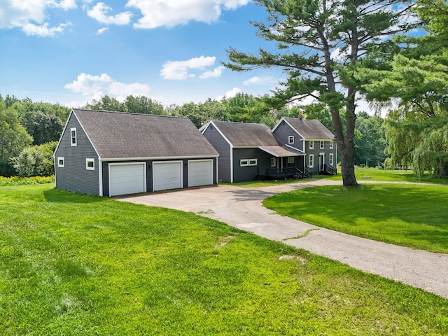 view of front of house with a garage and a front lawn