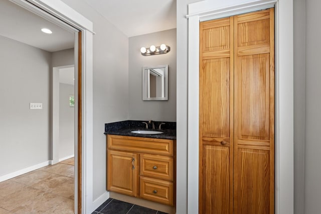 bathroom with tile patterned floors and vanity