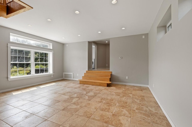 unfurnished living room with light tile patterned floors