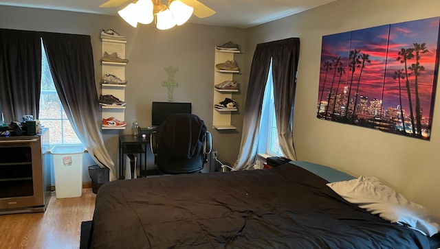 bedroom featuring ceiling fan and light hardwood / wood-style floors