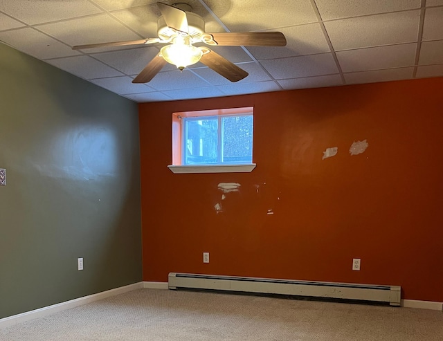 spare room with baseboard heating, ceiling fan, and carpet flooring