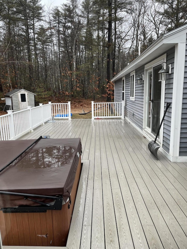 deck with a covered hot tub