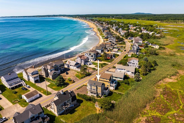 drone / aerial view with a water view and a view of the beach