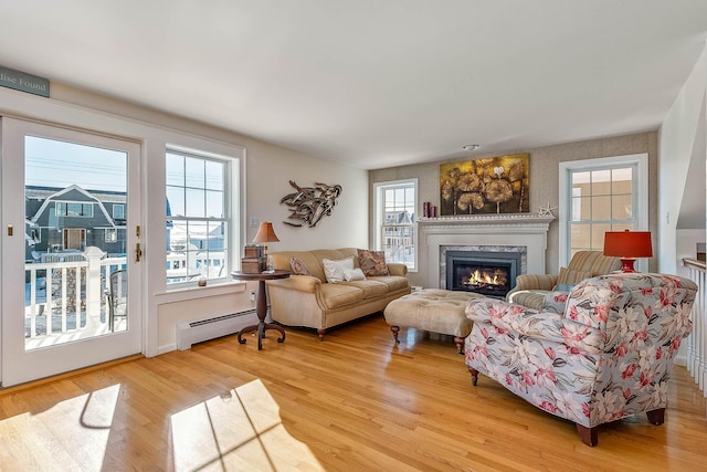 living room featuring light hardwood / wood-style flooring and a baseboard radiator