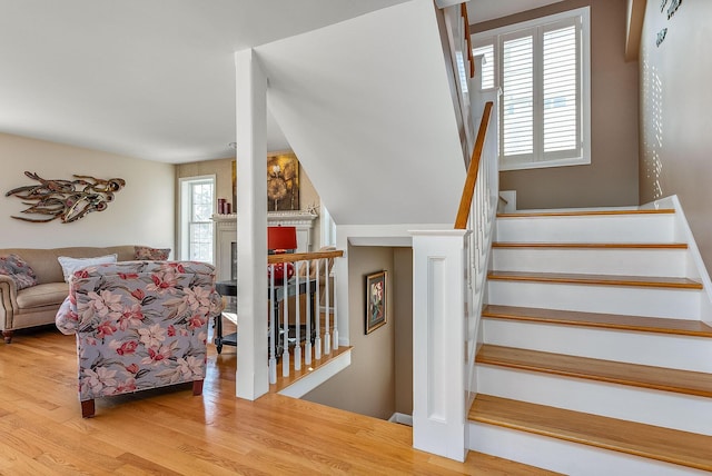 stairway featuring hardwood / wood-style flooring