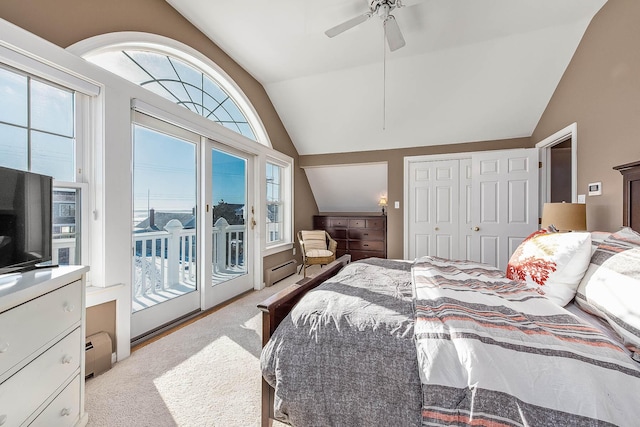 bedroom featuring light carpet, access to outside, ceiling fan, a baseboard heating unit, and a closet