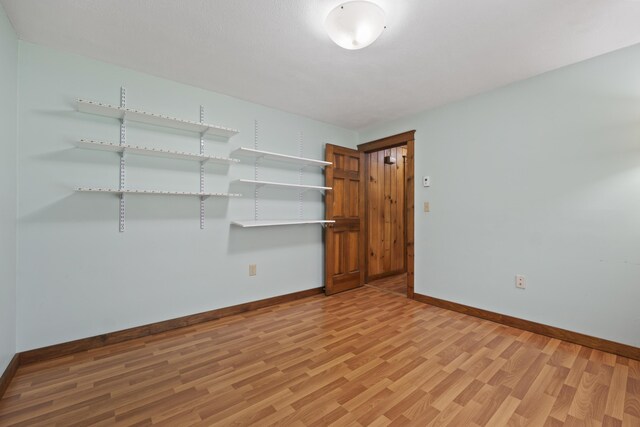 unfurnished room featuring light wood-type flooring