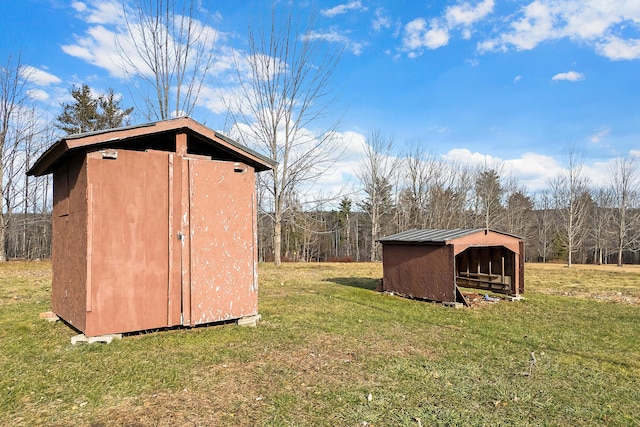 view of outdoor structure with a lawn