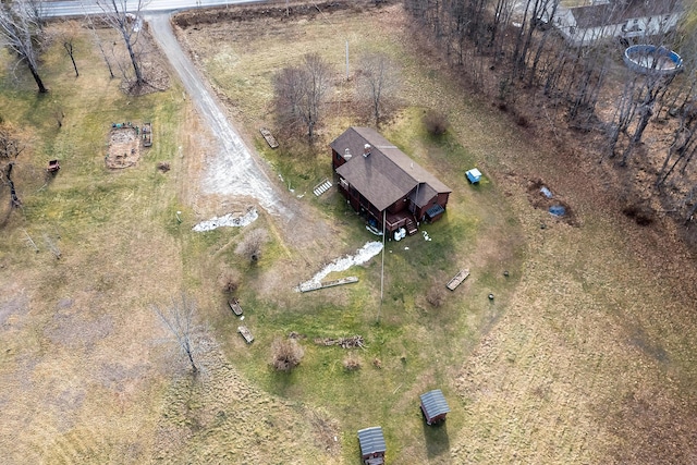 birds eye view of property with a rural view