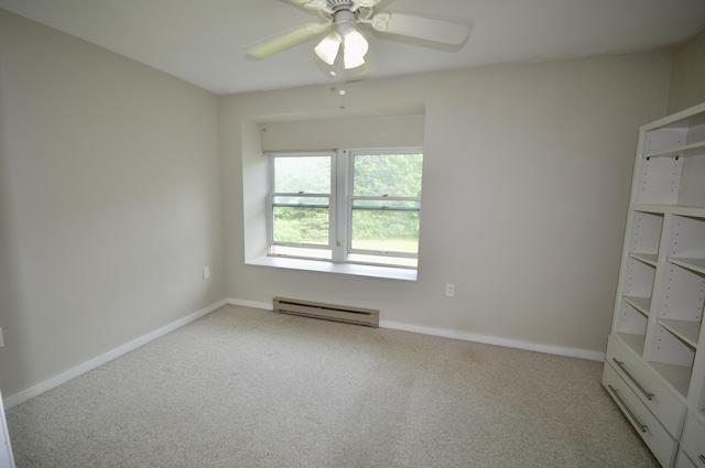 empty room with light colored carpet, ceiling fan, and a baseboard heating unit