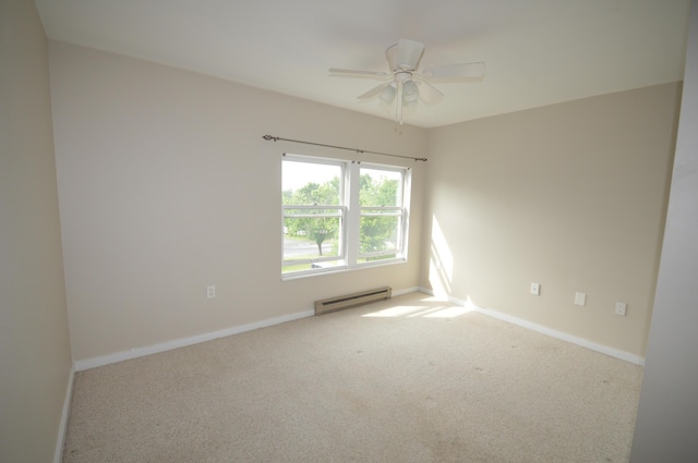 empty room featuring ceiling fan, carpet floors, and a baseboard radiator