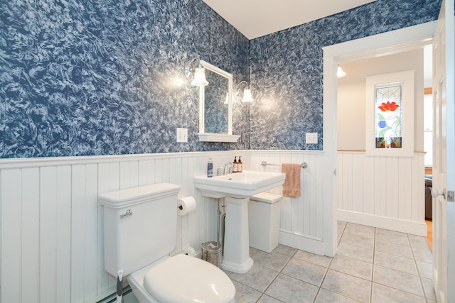 bathroom with tile patterned flooring and toilet