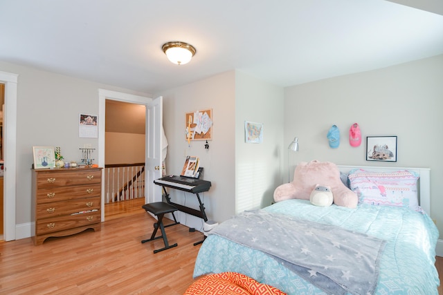 bedroom with light wood-type flooring