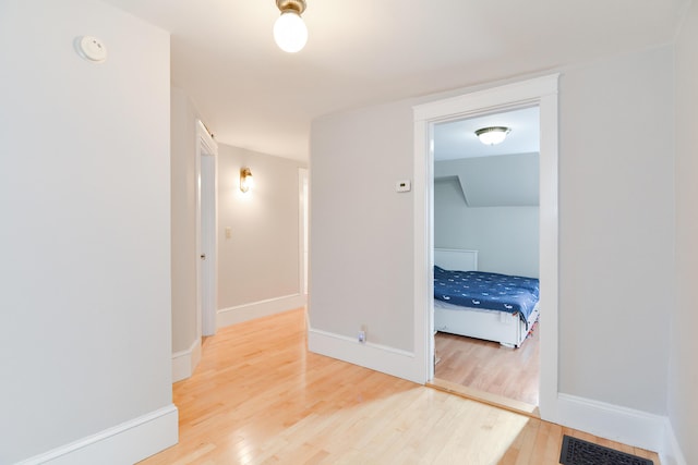 hallway featuring hardwood / wood-style flooring